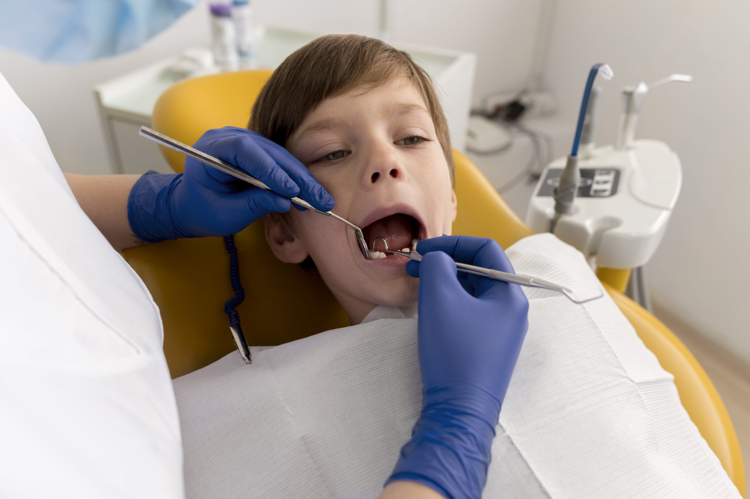 dentist-cleaning-child-s-teeth